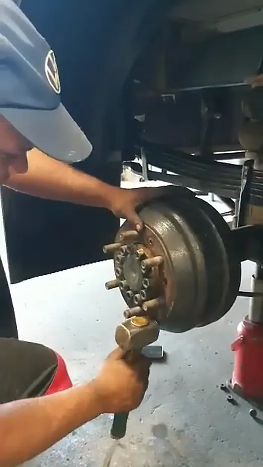 Close-up of the hub being seated with a hammer during refit