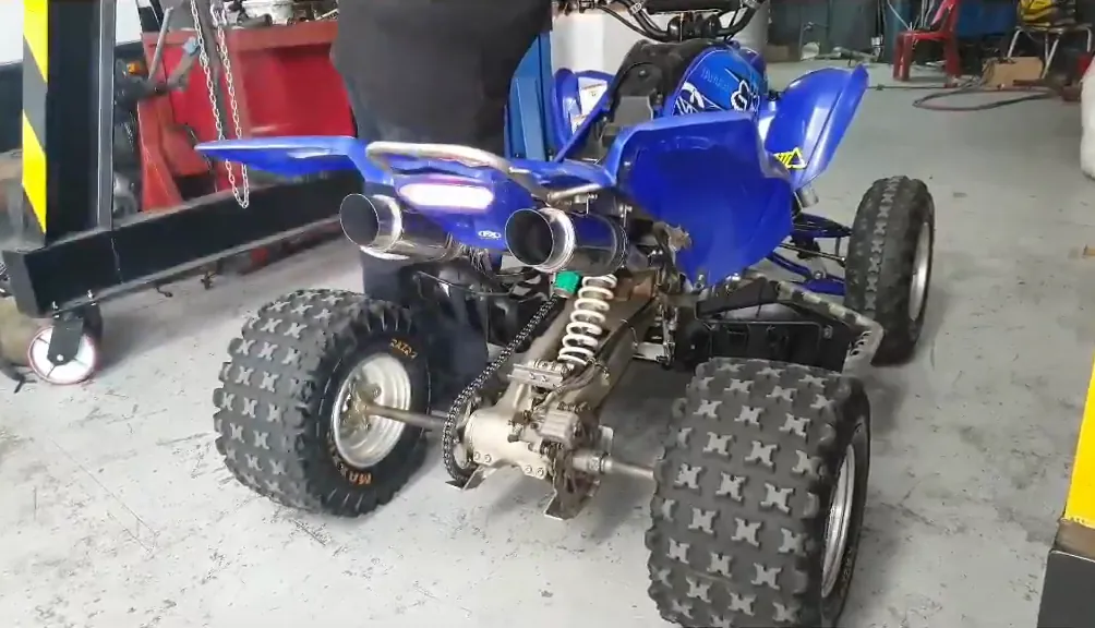 Blue Yamaha quad bike with a twin BOSSON exhaust system